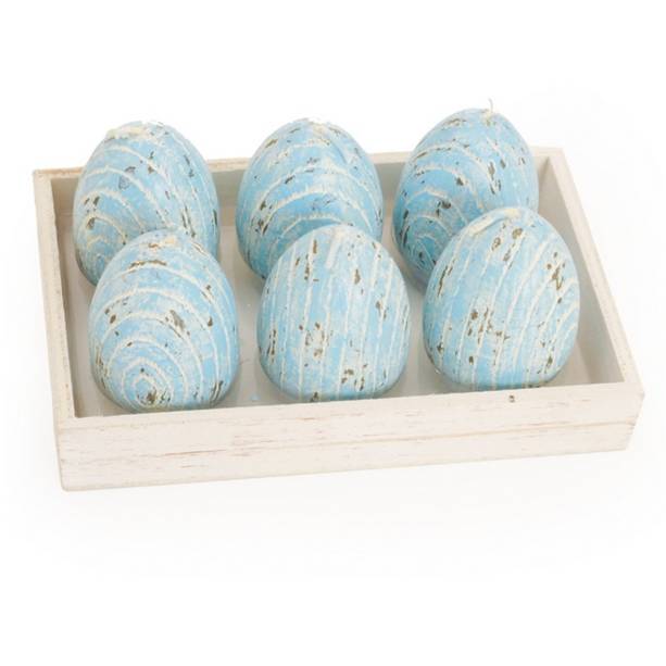 Vela r&uacute;stica Ovo de P&aacute;scoa, Cromus, de cera (4 x 7 cm). <a href="https://www.magazineluiza.com.br/vela-rustica-ovo-de-pascoa-decoracao-festa-6-unid-azul-cromus/p/5278418/am/vepa/" target="_blank" rel="noopener">Magazine Luiza</a>, R$ 56,90 a caixa com seis