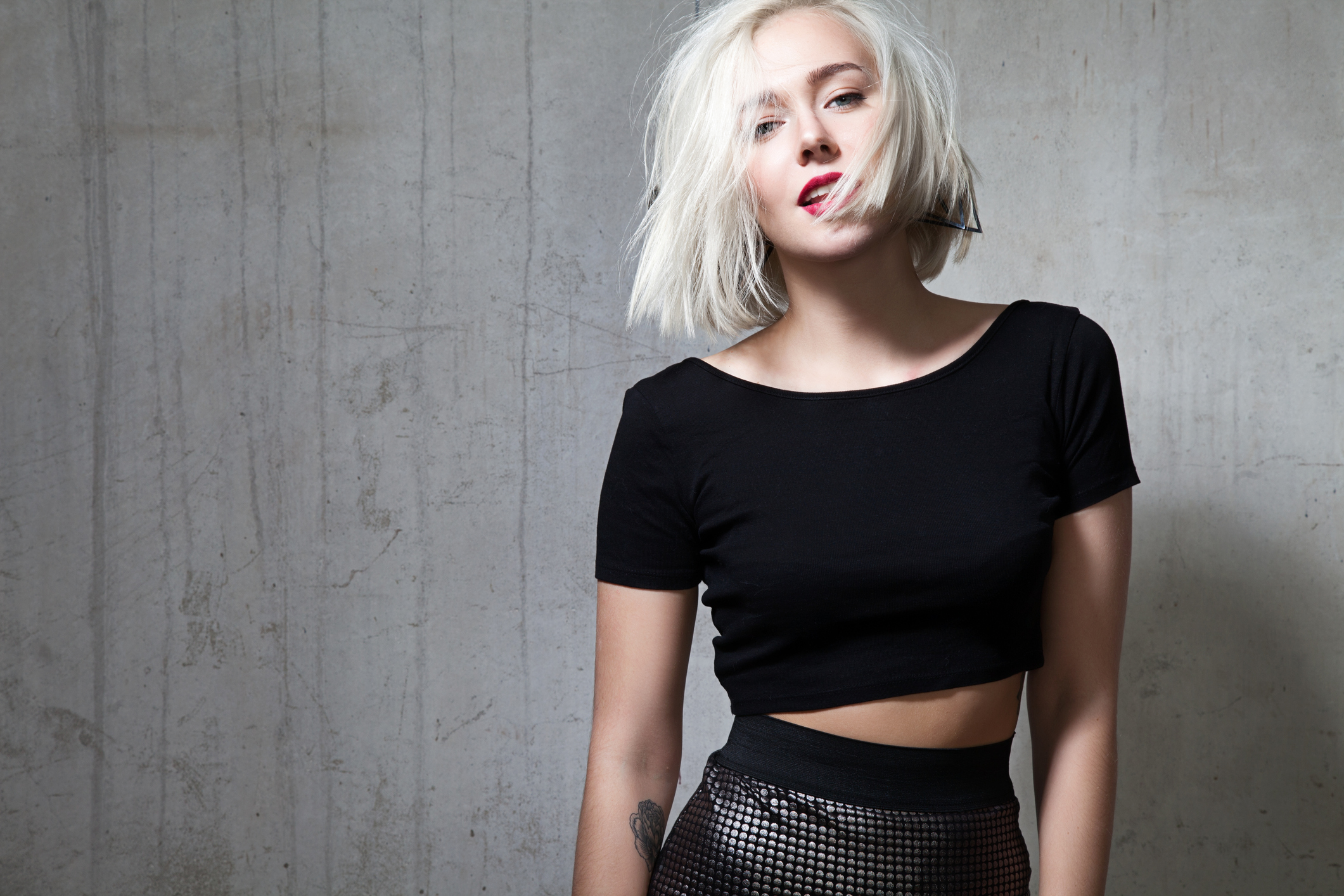 Girl with red lipstick and short hair in  black T-shirt