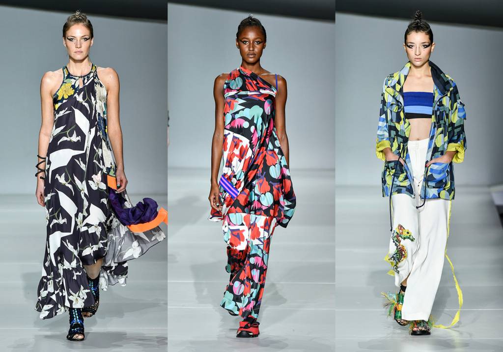 De volta ao line-up de desfiles do evento de moda mineira, a<strong> Anne Est Folle</strong> renovou suas caracter&iacute;sticas estampas multicoloridas com shapes mais volumosos e amarra&ccedil;&otilde;es estrat&eacute;gicas. Os prints s&atilde;o inspirados na geometria dos anos 1920 e em mosaicos ornamentais. Seguindo a linha maximalista das roupas, bijoux grandes e sapatos em croch&ecirc; bordado e com fiapos fluo deram o toque final.