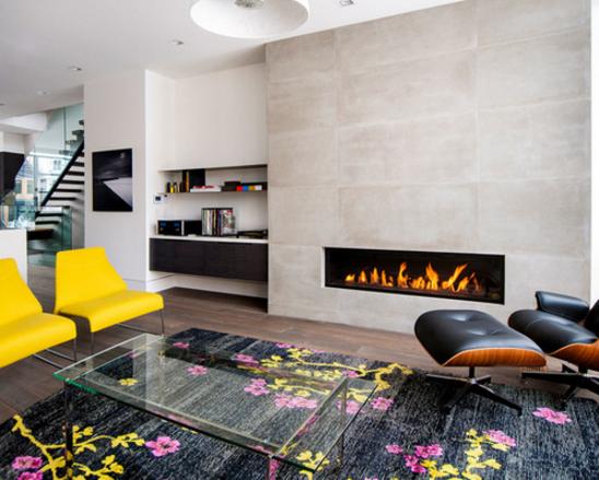 A lareira também tem uma parede exclusiva para ela nesta sala, onde as cadeiras amarelas e o tapete estampado são os grandes protagonistas. A lareira também tem uma parede exclusiva para ela nesta sala, onde as cadeiras amarelas e o tapete estampado são os grandes protagonistas.
