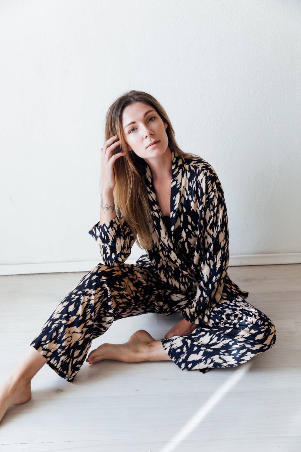 beautiful blonde woman in black silk pajamas sleepwear