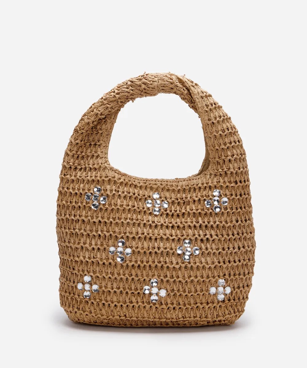 Foto de uma bolsa de palha com flores