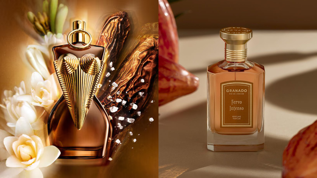 Dois frascos de perfume. À esquerda, um frasco marrom escuro com detalhes dourados em formato de busto feminino, cercado por flores brancas e grãos de café. À direita, um frasco retangular de vidro transparente com líquido âmbar, rótulo Granado Fervo Intenso e tampa dourada, sobre uma superfície clara com sombra