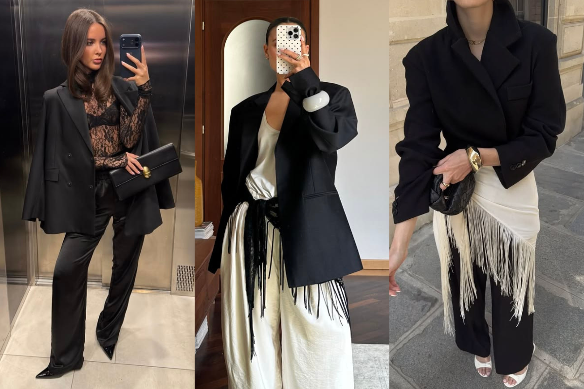 Três mulheres exibindo looks elegantes com blazers pretos. A primeira usa blazer sobre blusa de renda preta e calça de seda. A segunda, blazer oversized sobre regata branca e calça creme com franjas pretas. A terceira, blazer cropped sobre saia creme com franjas e calça preta