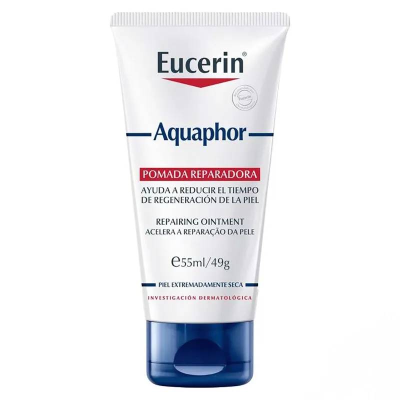 Tubo branco de pomada Eucerin Aquaphor, com tampa azul escura. O r&oacute;tulo vermelho indica Pomada Reparadora e Ajuda a reduzir o tempo de regenera&ccedil;&atilde;o da pele, em espanhol e portugu&ecirc;s. Cont&eacute;m 55ml/49g, para pele extremamente seca, resultado de investiga&ccedil;&atilde;o dermatol&oacute;gica